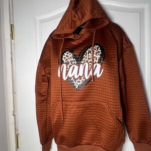 Mama  Hooded Sweat shirt,  textured, rust in color, size large..